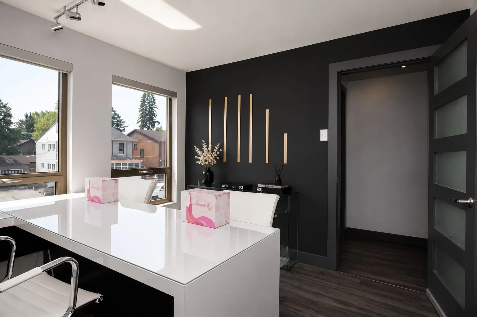 Consultation office with a matte black wall and gold bar décor