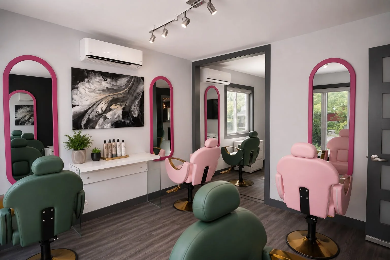 Hair area mixing pink and green chairs, arched mirrors and professional products