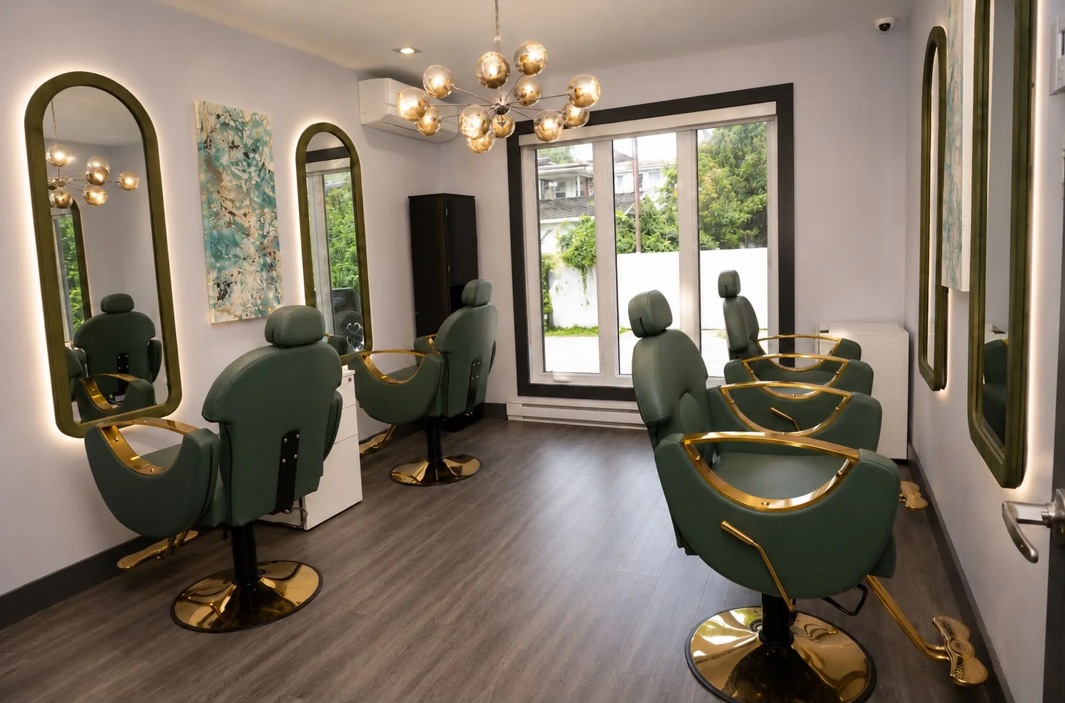 Sage-green styling stations bathed in natural light