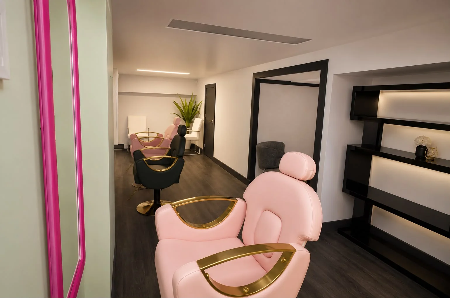 Perspective view of the institute's pink and gold styling stations
