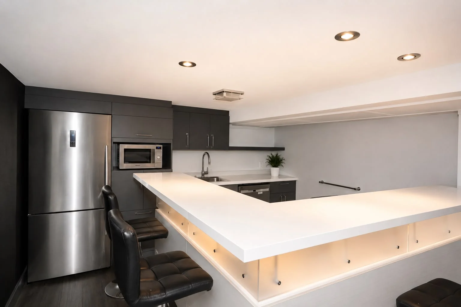 Team kitchen with a large backlit quartz counter