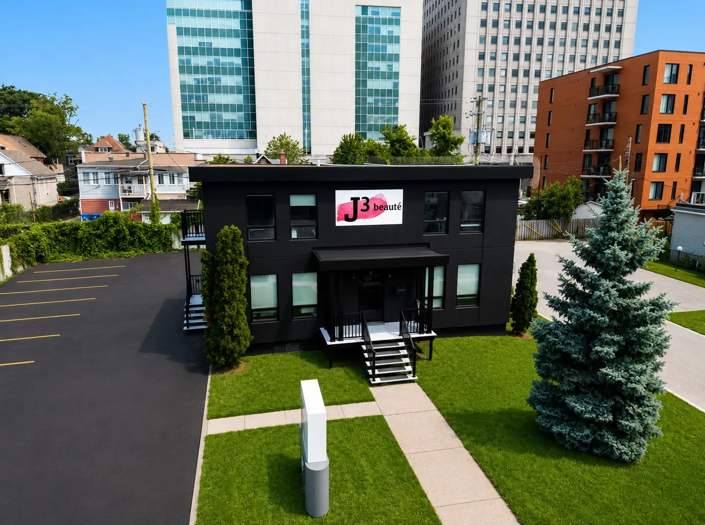 Close aerial view of the J3 beauté building and its private parking