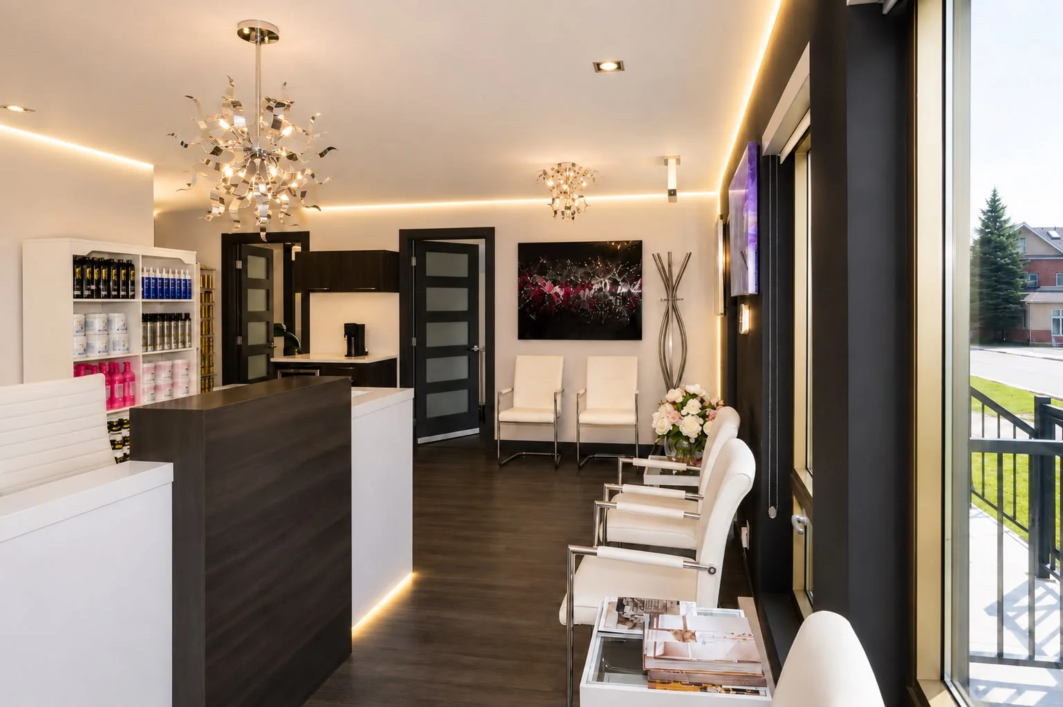 J3 beauté reception and waiting area with designer chandeliers and product boutique